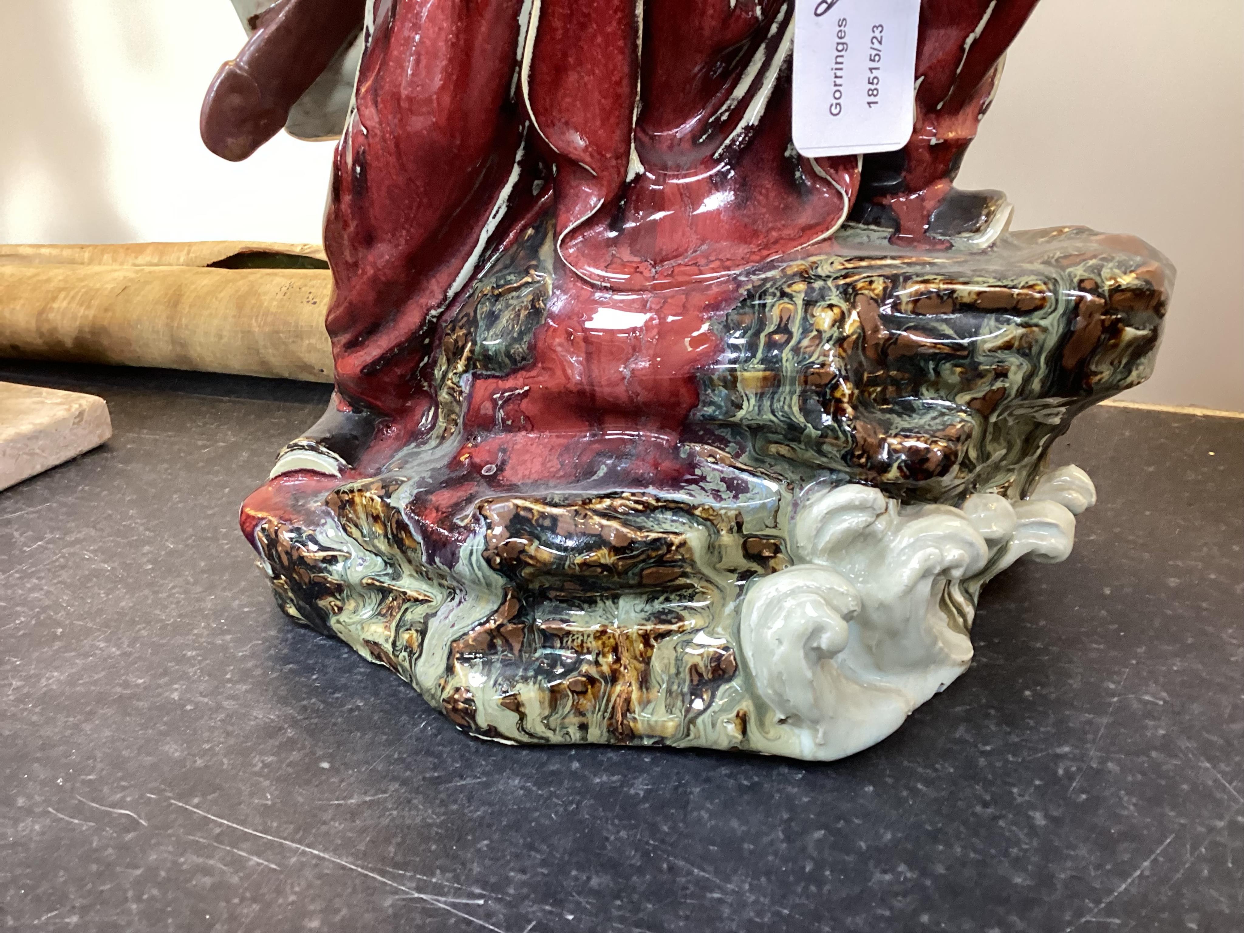 A large Chinese Shiwan stoneware figure of a warrior, 20th century